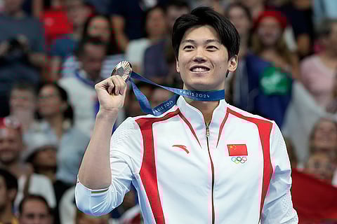 Shun Wang after receiving his bronze medal in men's 200-meter individual medley final